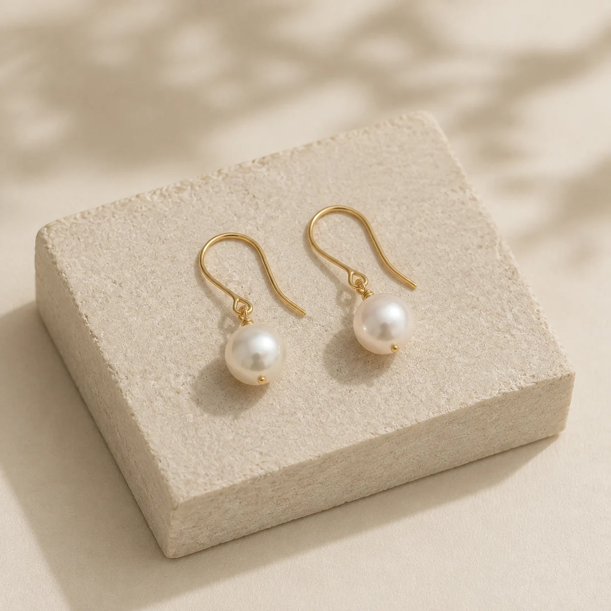 Pearl Drop Earrings — opposite three-quarter view