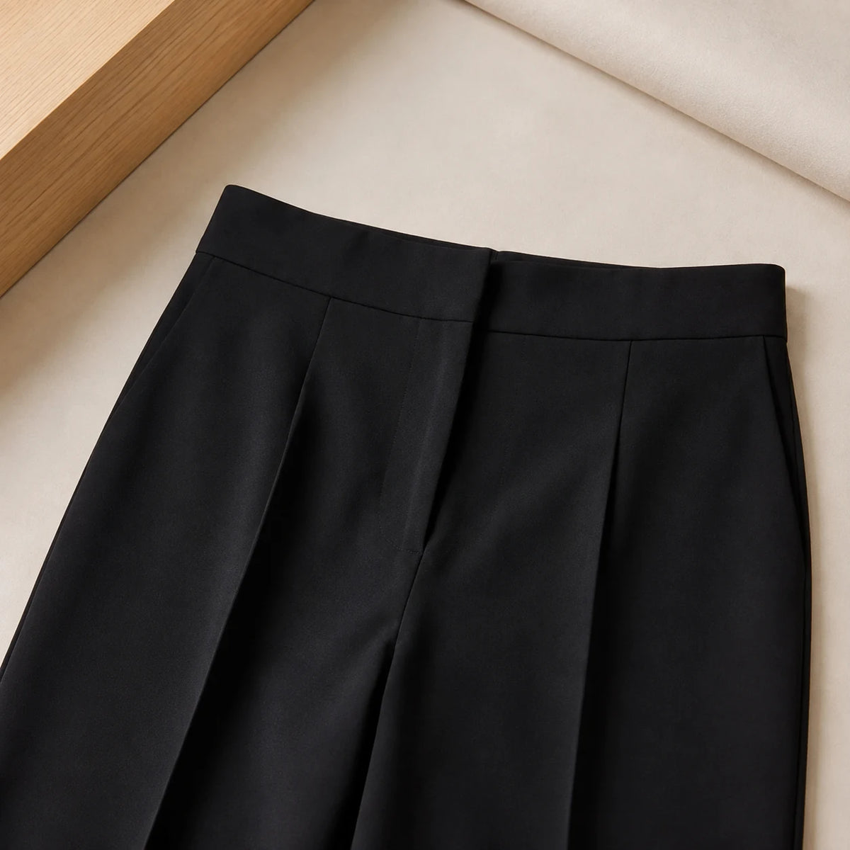 Wide-Leg Trouser in Black — close detail: High rise, clean front