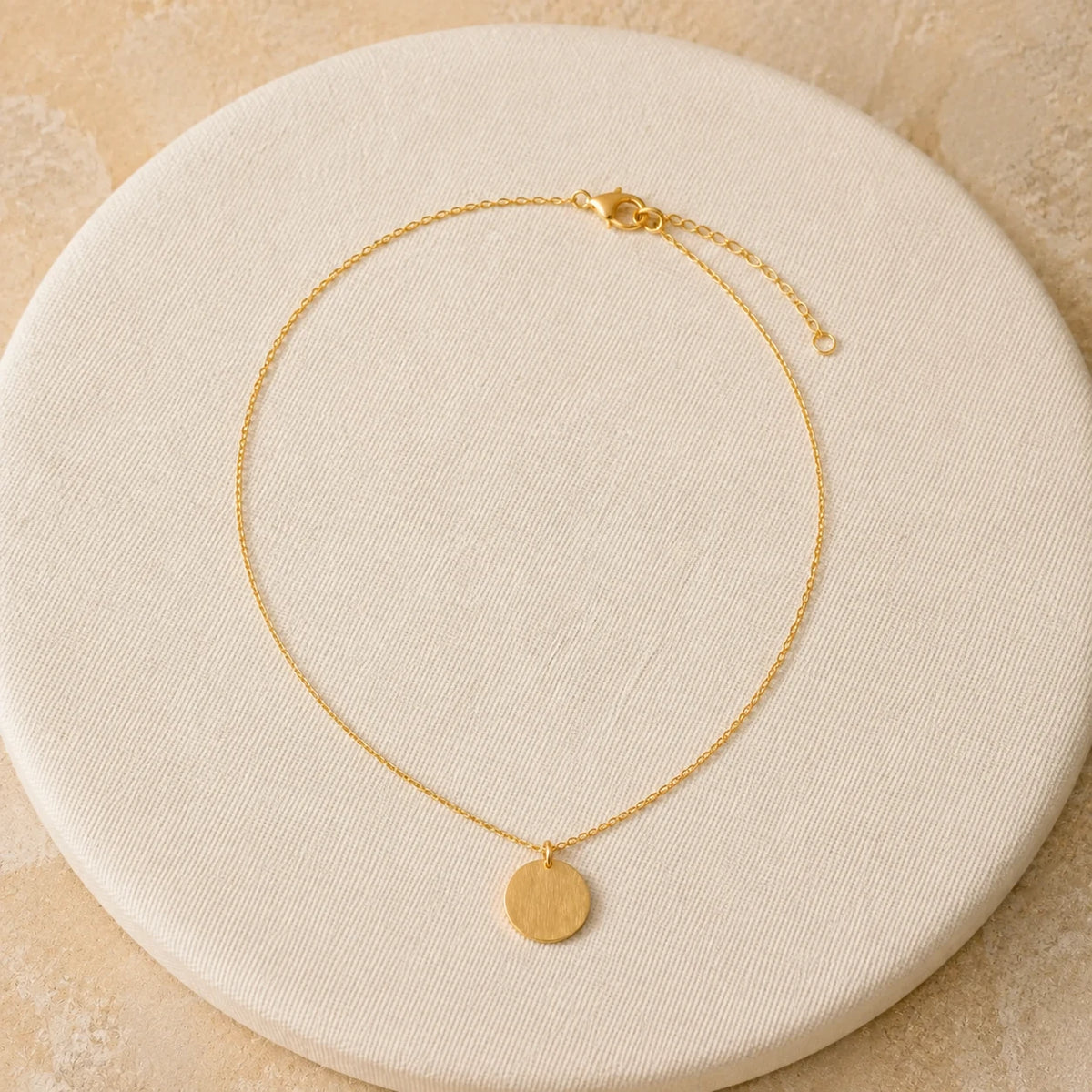 14K Disc Pendant in Yellow gold — top-down flat lay view