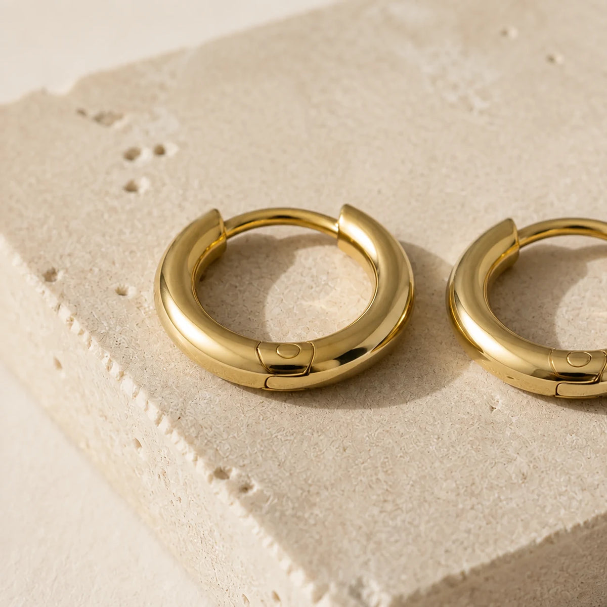 14K Huggie Hoops — close detail: Solid 14K gold